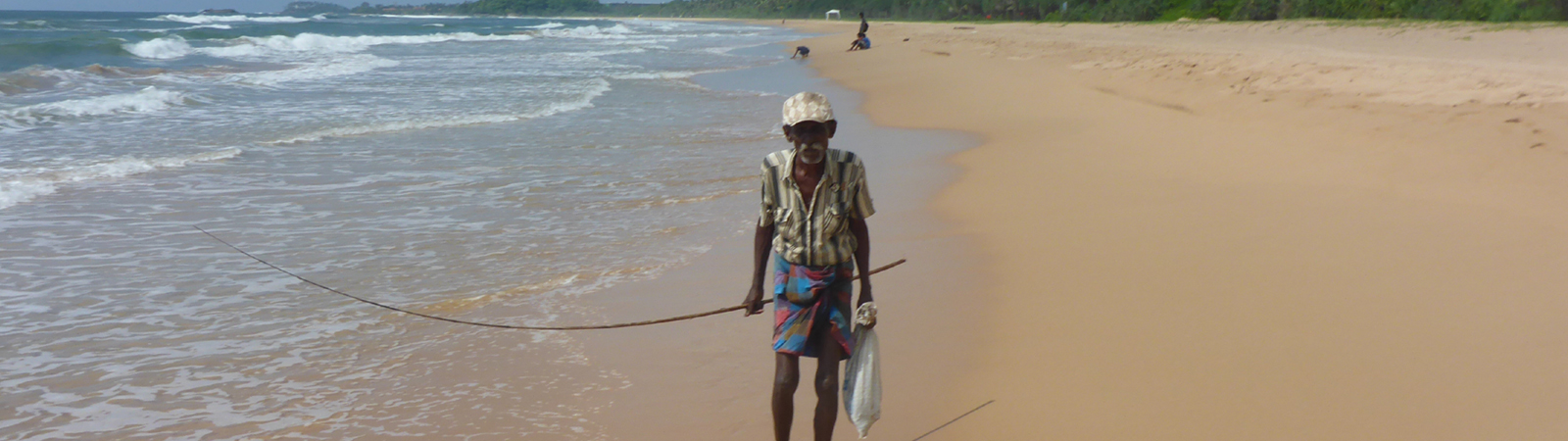 fisher on the beach Sri Lanka by bike